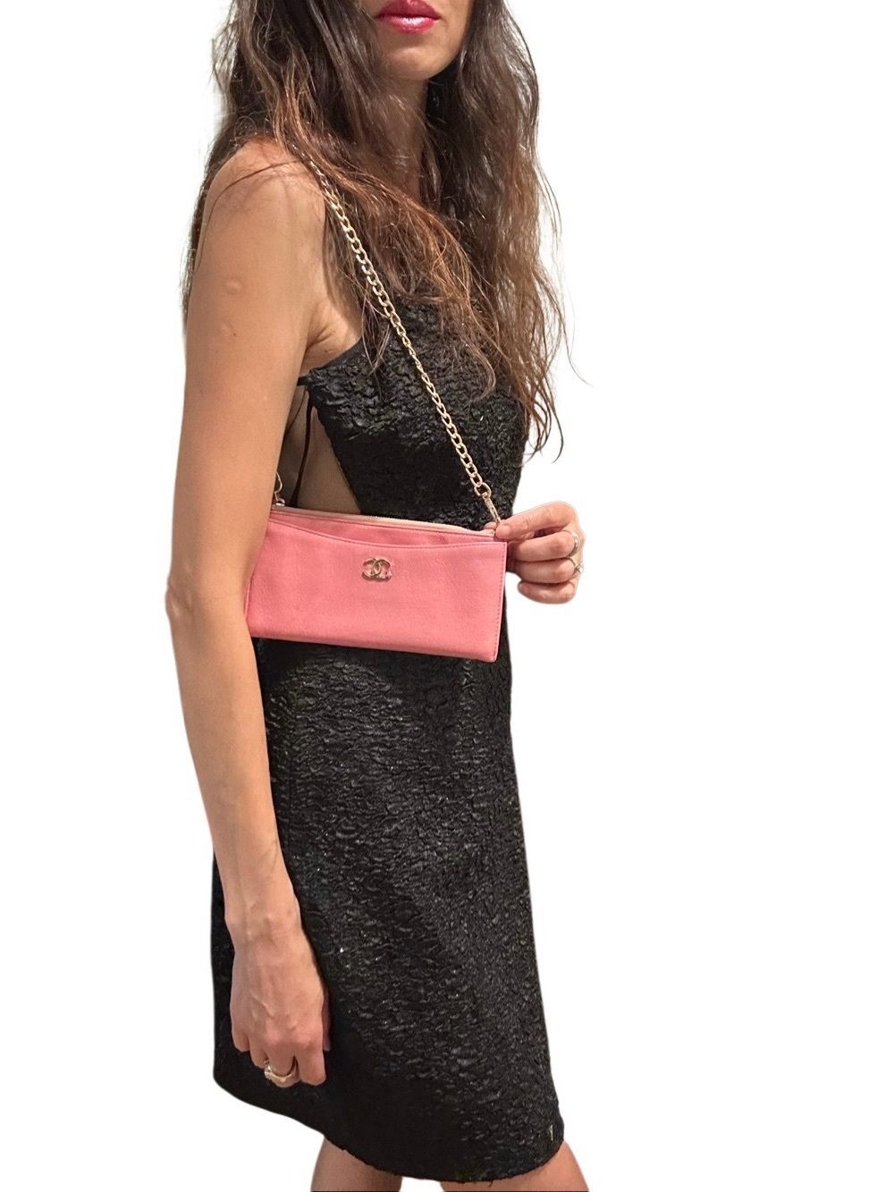 Chanel Pink Clutch with Iconic Logo and Minimalist Design
